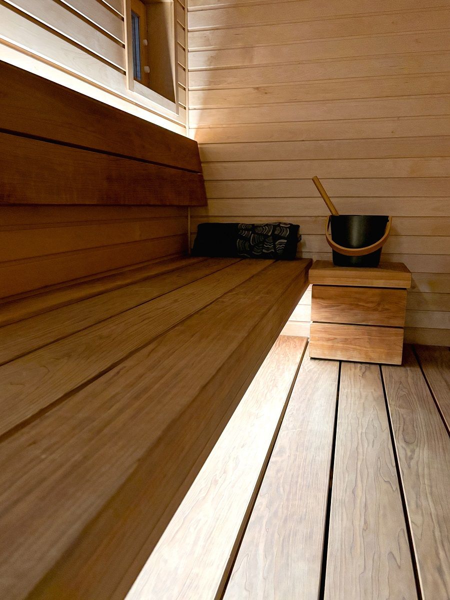 The lighting in the sauna was made successful by bringing light behind the backrest and under the seat. © LedStore.fi